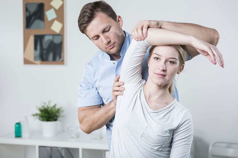 physiotherapist with patient